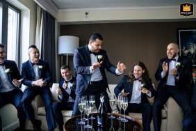 At VUE on 50 in PA, the groom and groomsmen enjoy an informal, fun portrait session indoors.